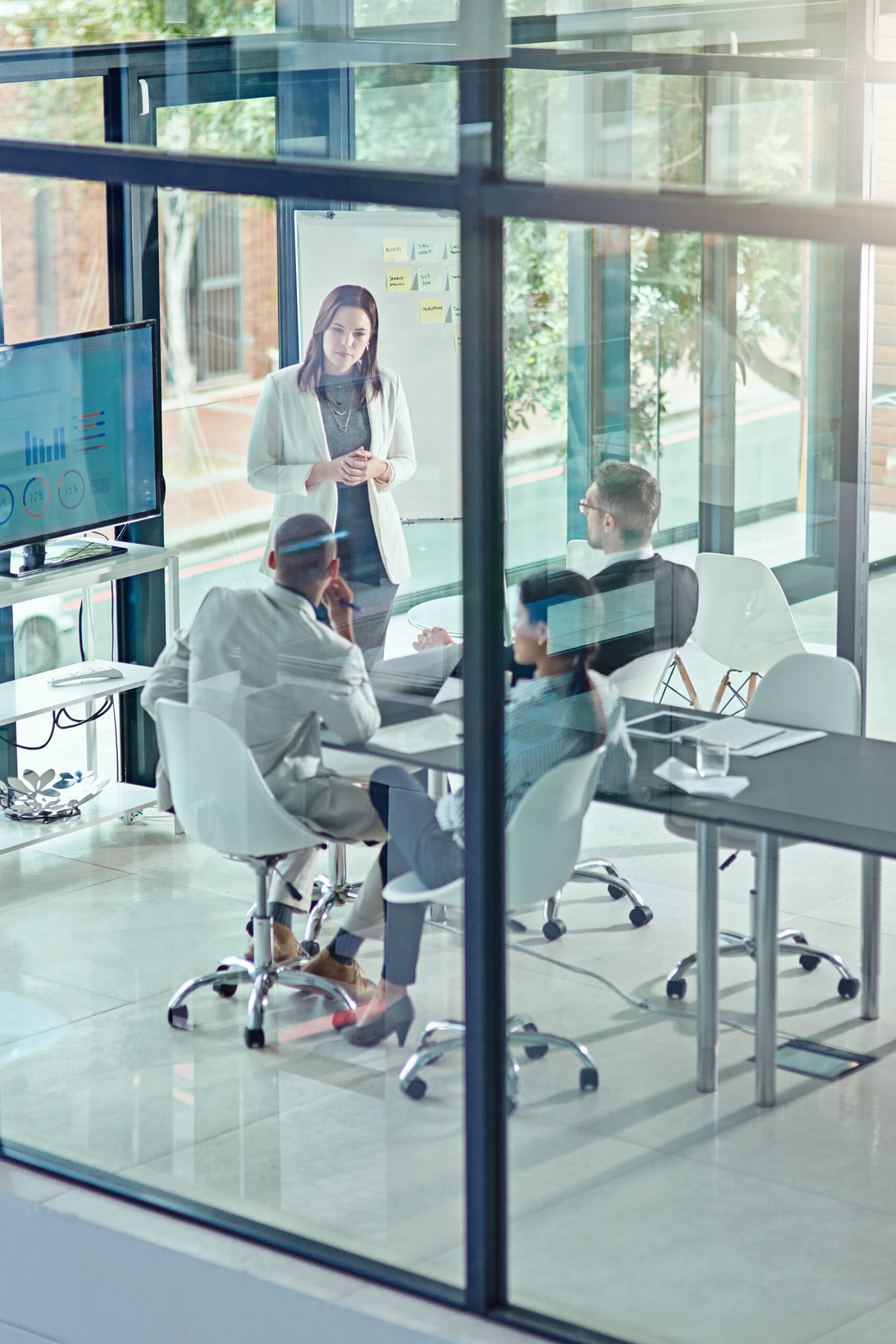 Presentation, above and team with business woman in office for private equity, planning and meeting. Investment banker, broker pitch and portfolio tracking with employees for feedback and proposal